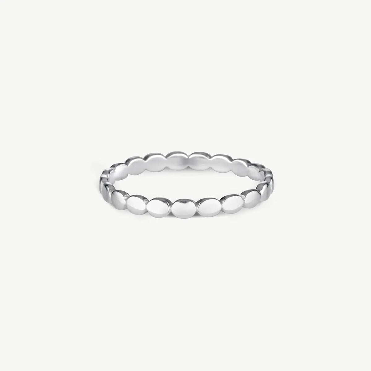 A silver beaded stretch band ring with a polished finish, displayed on a clean, light gray background.
