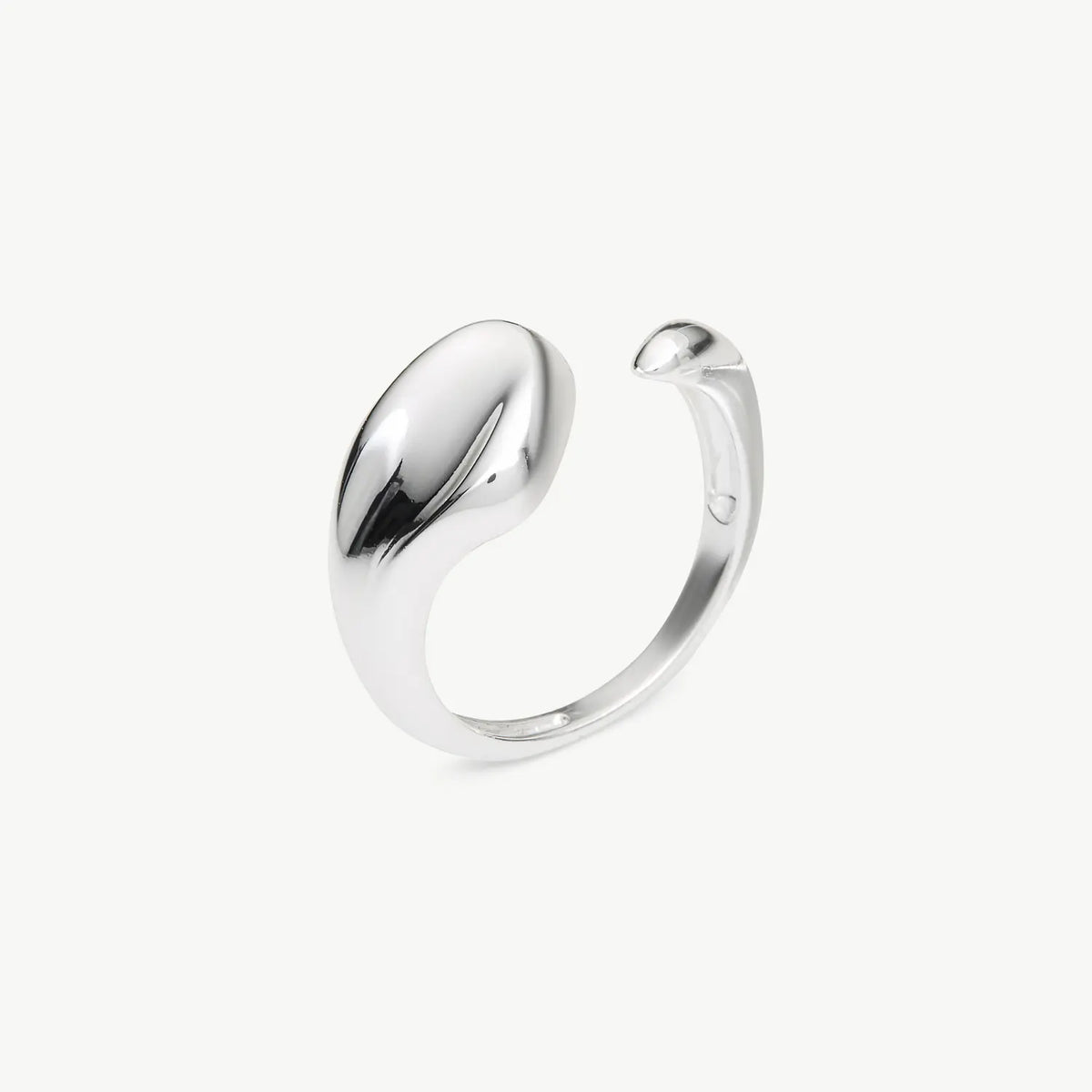 A polished silver open cuff ring with a smooth, organic curved shape, shown on a clean off-white background.