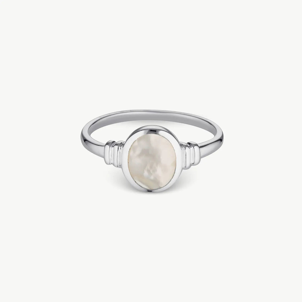 A silver ring featuring an oval mother-of-pearl centerpiece, set against a clean, off-white background.