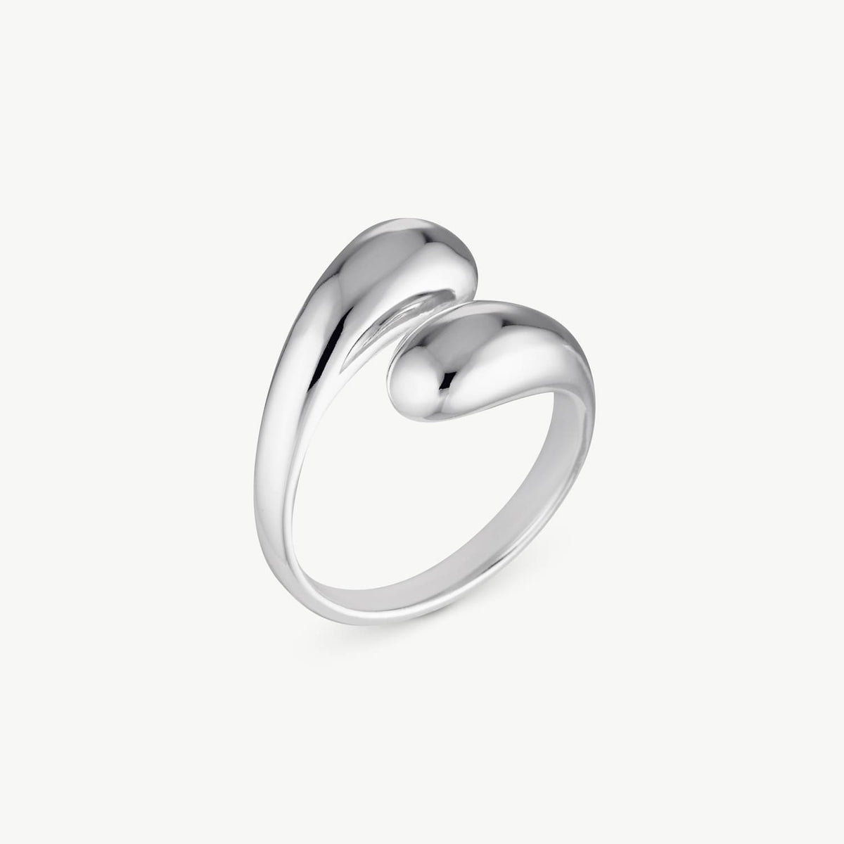 A polished silver ring with a sculptural, fluid design resembling two rounded, intertwined teardrop-like forms, shown on a clean off-white background.