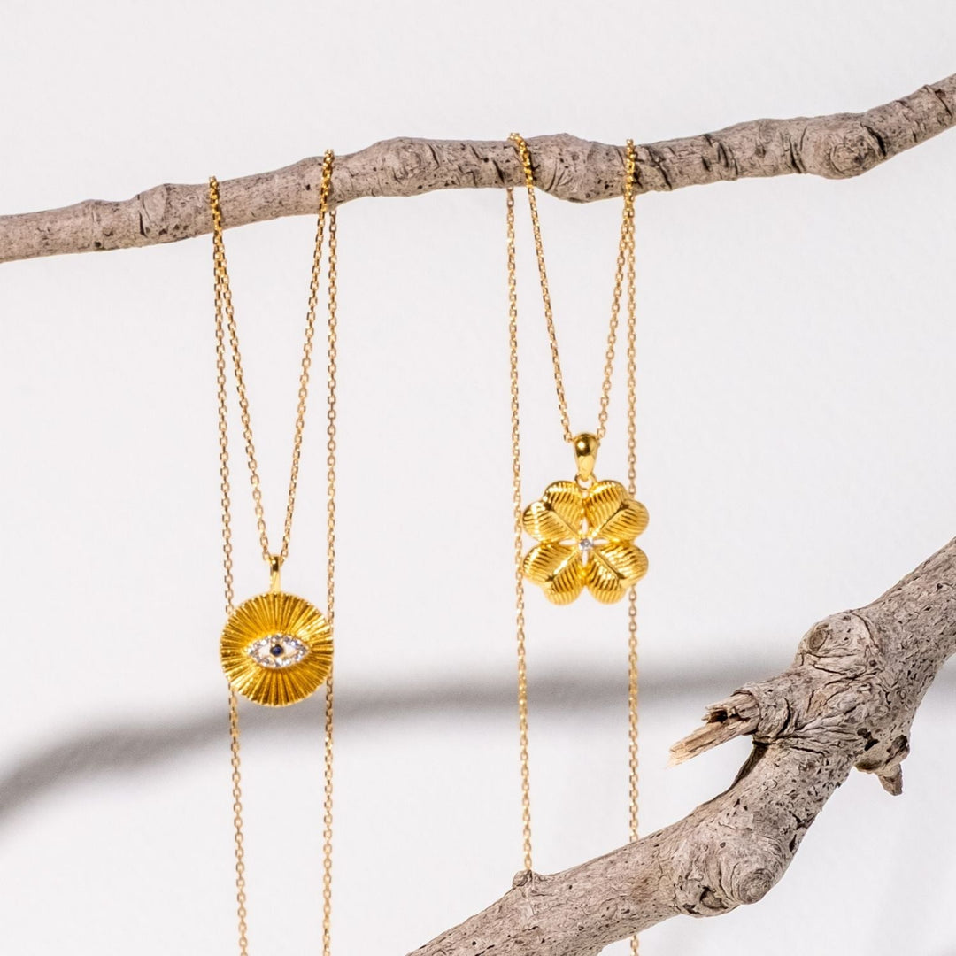 evil-eye-and-four-leaf-clover-necklace-in-yellow-gold