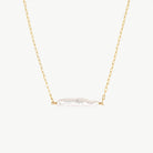 white Horizontal Biwa pearl hanging from a yellow gold chain on a white background 