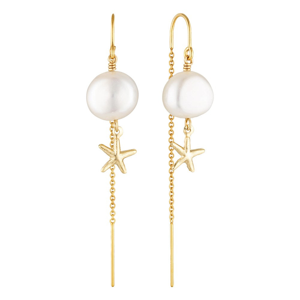 Pearl and starfish earrings with gold chains on a white background