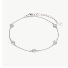 A delicate silver chain bracelet featuring five oval-cut iridescent opal stones, displayed on a clean off-white background.