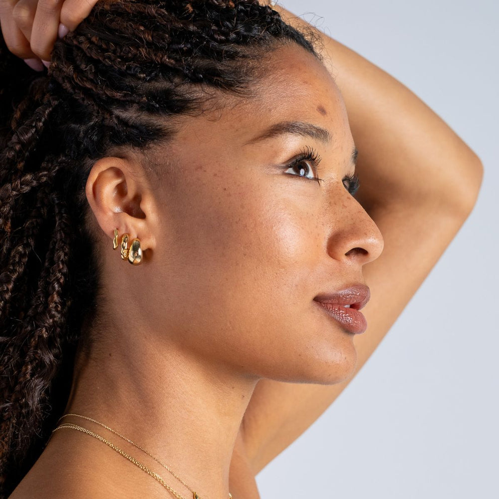 Gold-Wide Tapering Huggie Hoop Earrings on model-Australian Jewellery Brand Bowerbird Jewels