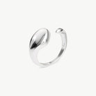 A polished silver open cuff ring with a smooth, organic curved shape, shown on a clean off-white background.