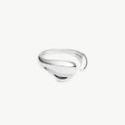 Silver open scuplted ring on grey background
