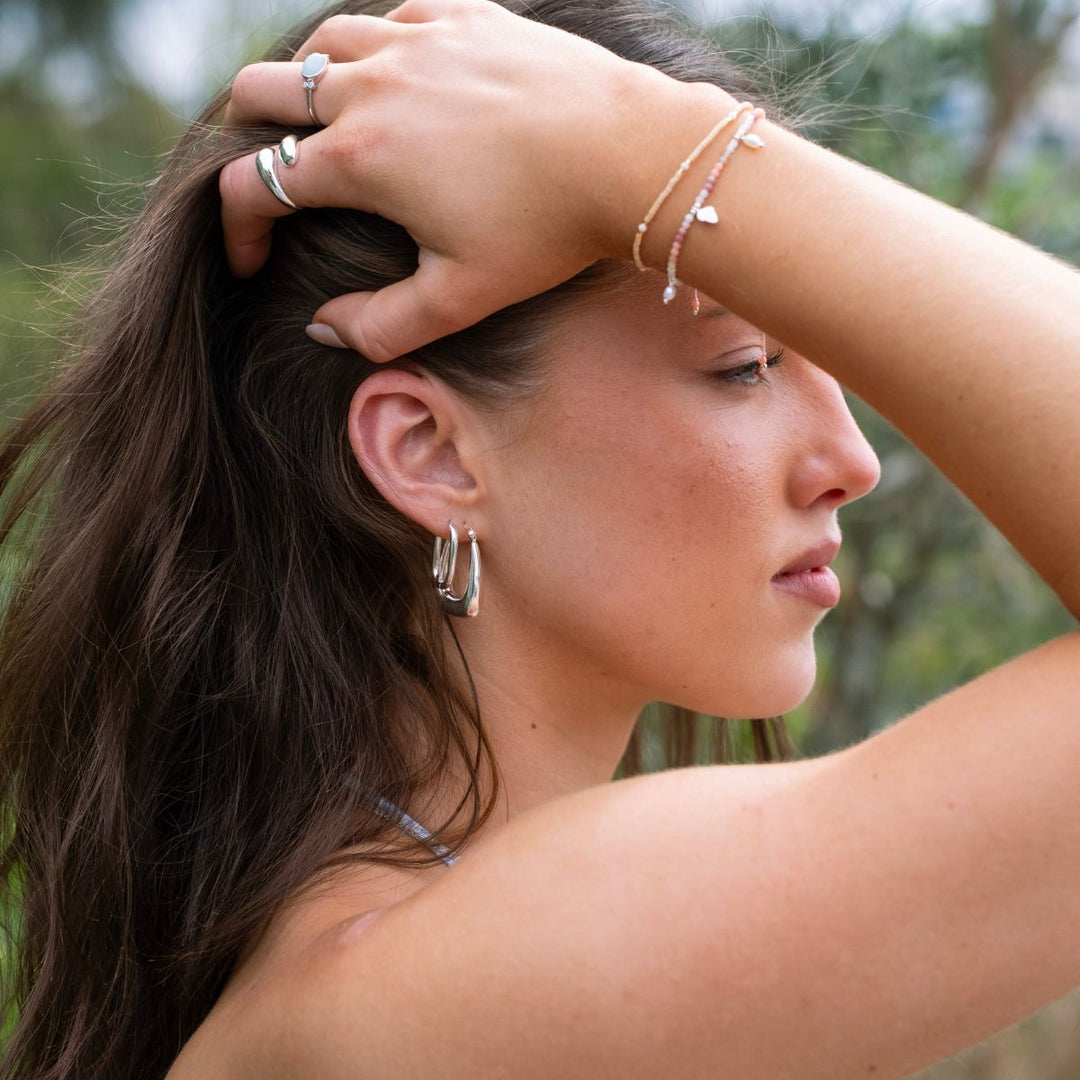Silver-Polished Oval Silver Huggie Earrings2 on model-Australian Jewellery Brand Bowerbird Jewels