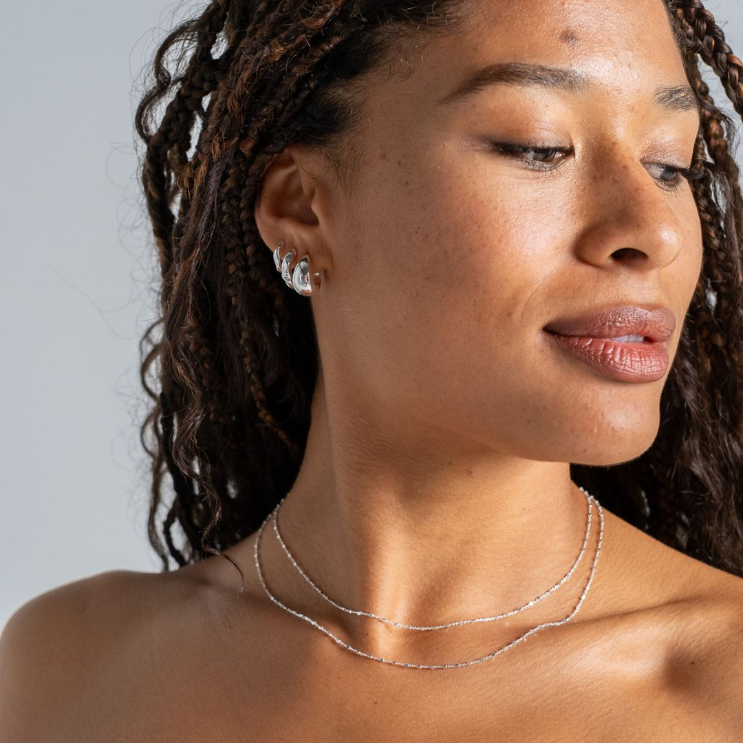 Silver-Wide Tapering Huggie Hoop Earrings on model-Australian Jewellery Brand Bowerbird Jewels