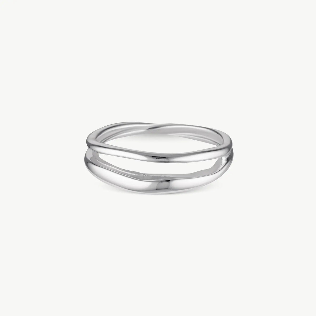 A minimalist silver ring with a double, wavy, intertwined band design, shown on a clean off-white background.