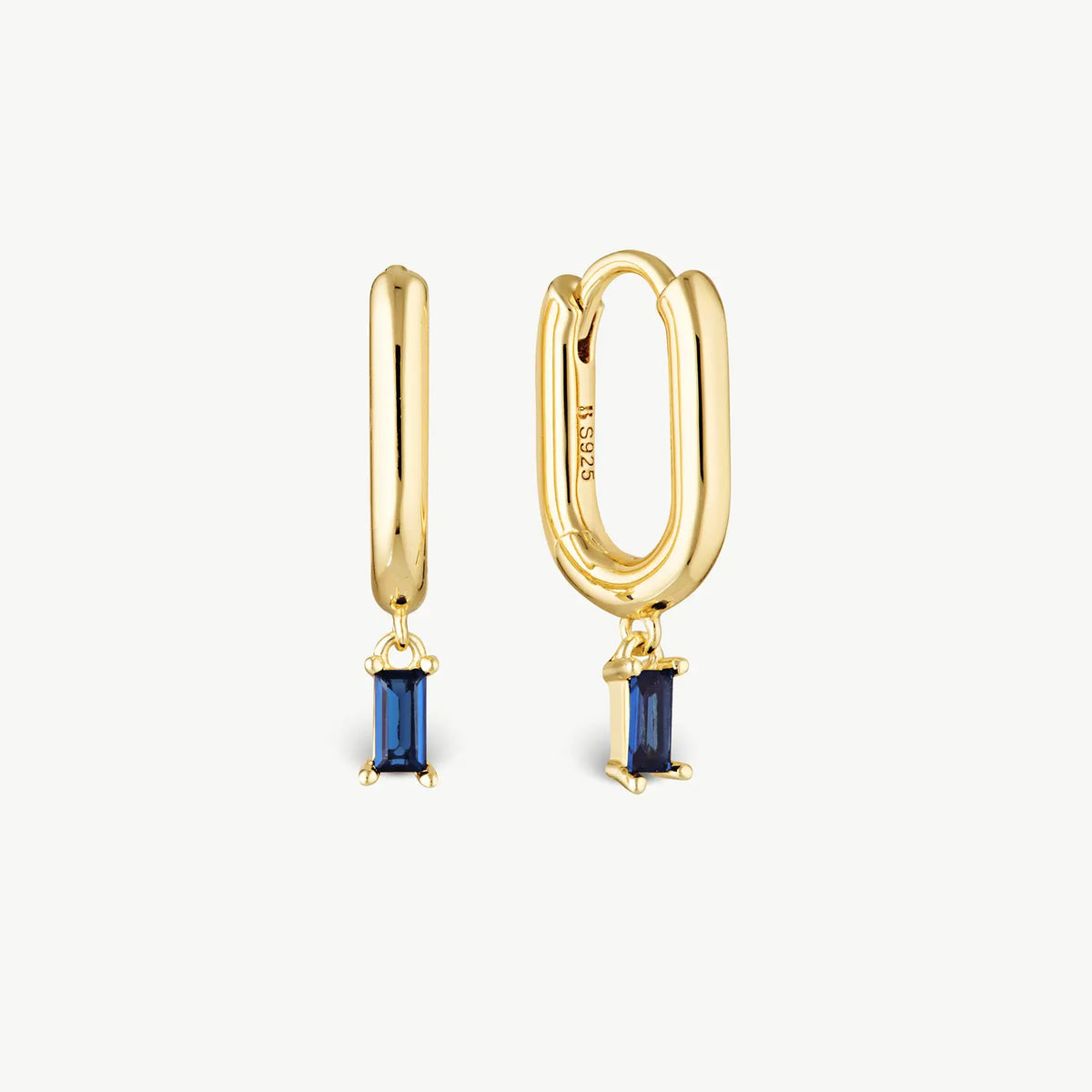 A pair of gold huggie hoop earrings with rectangular blue gemstone drops, shown on a clean off-white background. One earring is shown from the front and the other from the side, revealing an 'S925' engraving on the side hoop.
